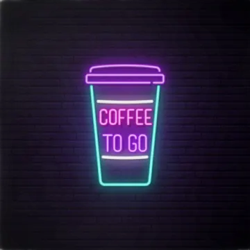 coffee to go neon sign on a brick wall