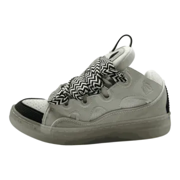 a pair of sneakers with black and white patterns