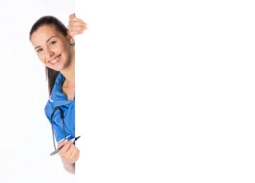 a woman in a blue shirt holding a white board