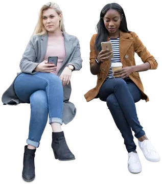 two women sitting next to each other woman