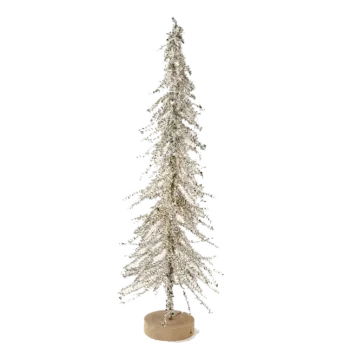 a white christmas tree on a wooden base
