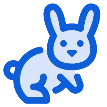 a blue rabbit sitting down on the ground