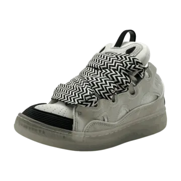 a pair of sneakers with black and white che print