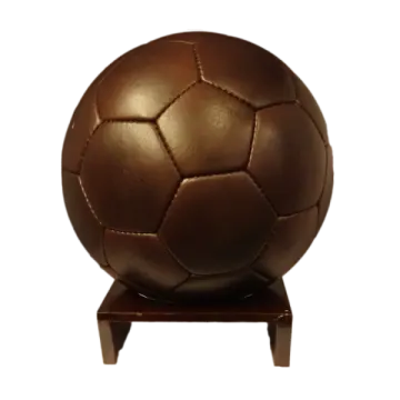 a brown soccer ball on a wooden stand