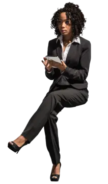 a woman in a business suit is sitting on the floor