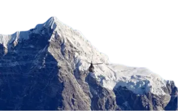 a helicopter flying over the top of a mountain