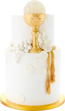 a white cake with gold decorations on top