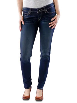 a woman wearing jeans and heels