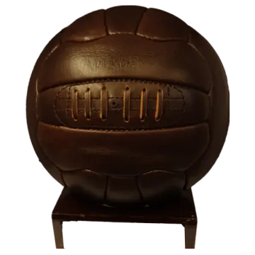 a brown leather soccer ball on a stand