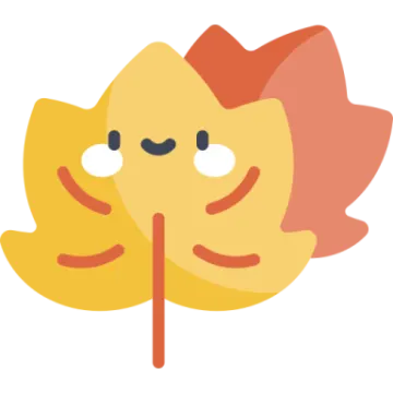 a yellow and red leaf with a smiley face
