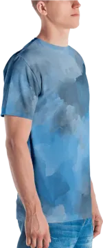 a man wearing a blue t - shirt with clouds on it