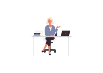a person sitting at a desk with a laptop