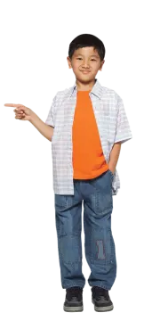 a young boy wearing an orange shirt and blue jeans