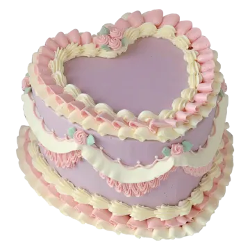 a heart shaped cake with pink and white frosting