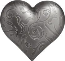 a heart shaped metal object on a white background