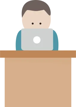 a person sitting at a desk with a laptop