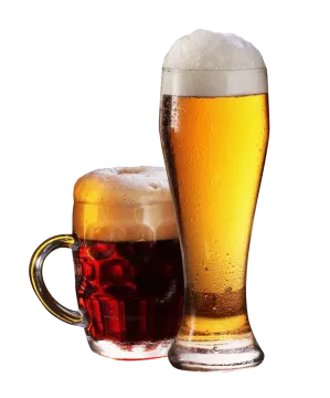 a glass of beer next to a mug