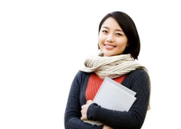 a woman wearing a scarf and holding a laptop