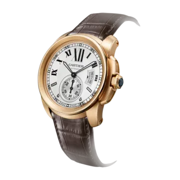 a gold watch with brown leather straps