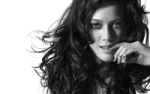 a black and white photo of a woman with long hair