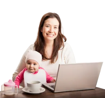 a woman holding a baby in front of a laptop