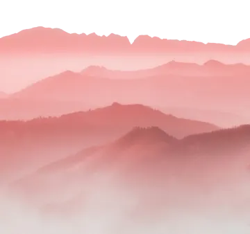 the mountains are covered in fog