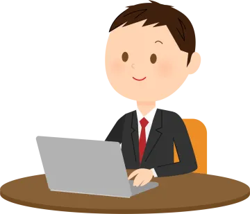 a man in a suit sitting at a table with a laptop