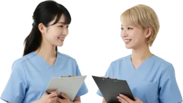two women wearing scrubs and holding clipboards