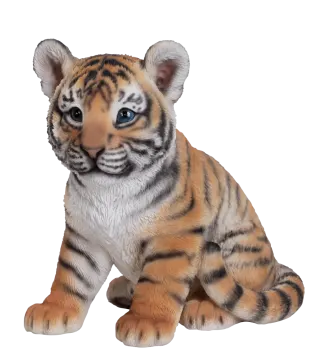 a stuffed tiger cub sitting on a white background