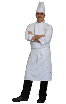 a chef standing with his arms crossed