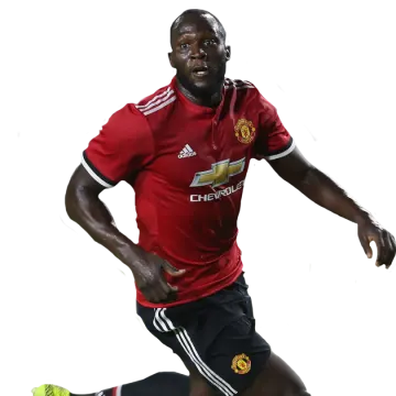 a man in a red shirt running with a soccer ball