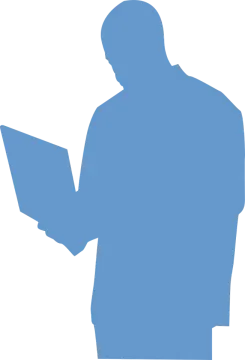 a silhouette of a man holding a laptop