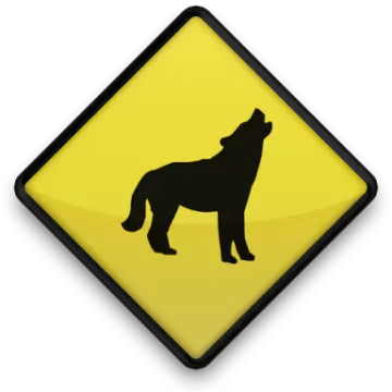 a yellow button with a black silhouette of a wolf