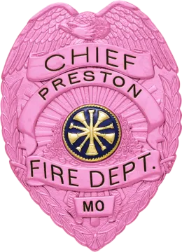 a pink badge with the words chief fire department on it