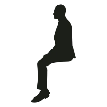 a silhouette of a man sitting on the ground