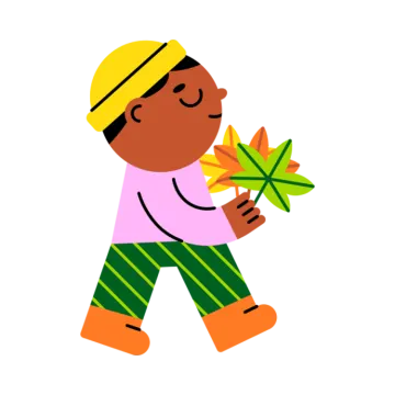 a boy holding a leaf in his hand