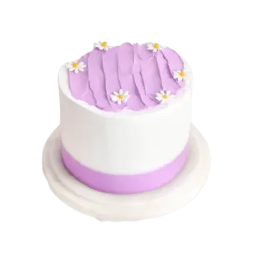 a white and purple cake with flowers on top