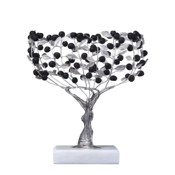 a silver and black tree sculpture on a marble base
