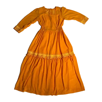 an orange dress with yellow embroidery on the shoulders