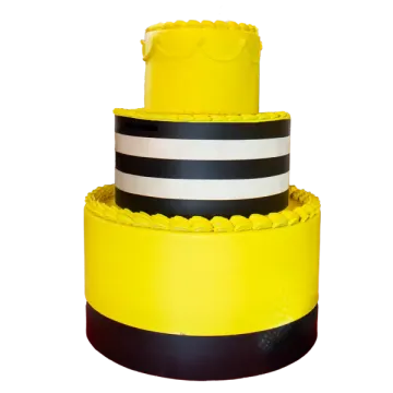 a yellow cake with black and white stripes