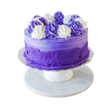 a purple cake with white frosting on top