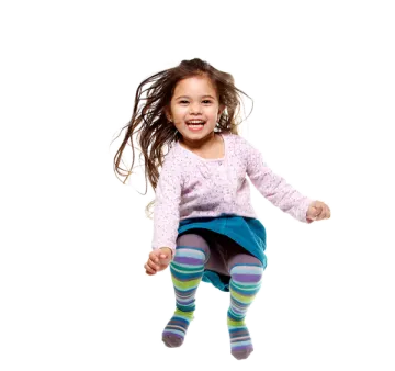 a little girl is jumping in the air