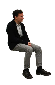 a man sitting on top of a wooden bench
