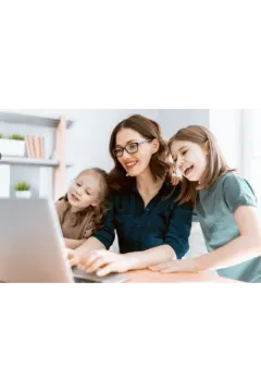 a woman and two young girls looking at a laptop