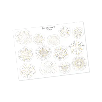 a white card with gold foil flowers on it