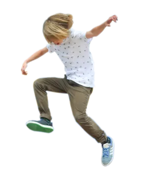 a young boy is jumping in the air