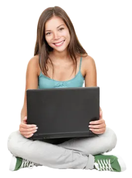 a young woman sitting on the floor with her laptop