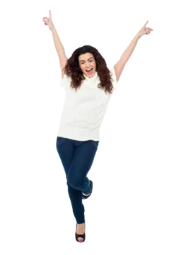 a woman jumping in the air with her arms outstretched