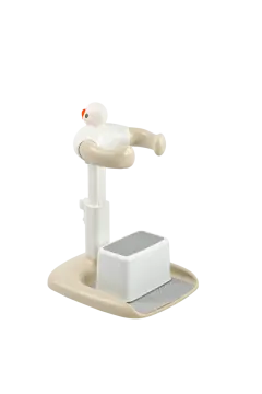 a white and beige device with a red button on it