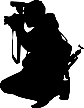 a silhouette of a man with a camera